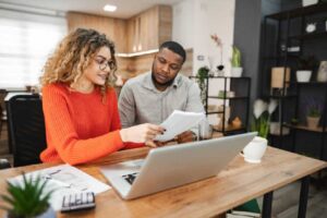 Person analyzing financial data with a focus on loan and insurance decisions during top-down processing.